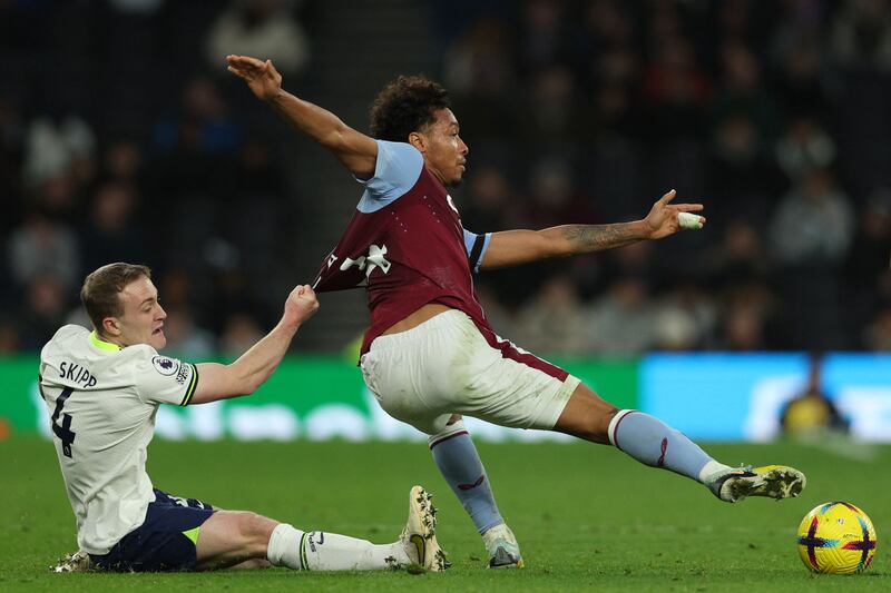 Spurs' Oliver Skipp resorts to desperate measures in a bid to stop Aston Villa's Boubacar Kamara. Photograph: Adrian Dennis/AFP via Getty Images