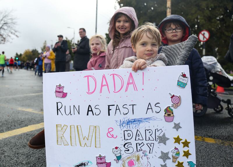 Dublin Marathon 2023: A young spectator waits for his Dad Oisín to run past. Photograph: Nick Elliott/Inpho