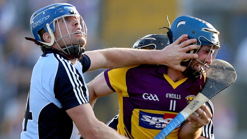 Dublin’s Conal Keaney battles with Garrett Sinnott of Wexford during last Saturday’s Leinster quarter-final at  Wexford Park. Photograph: Inpho.