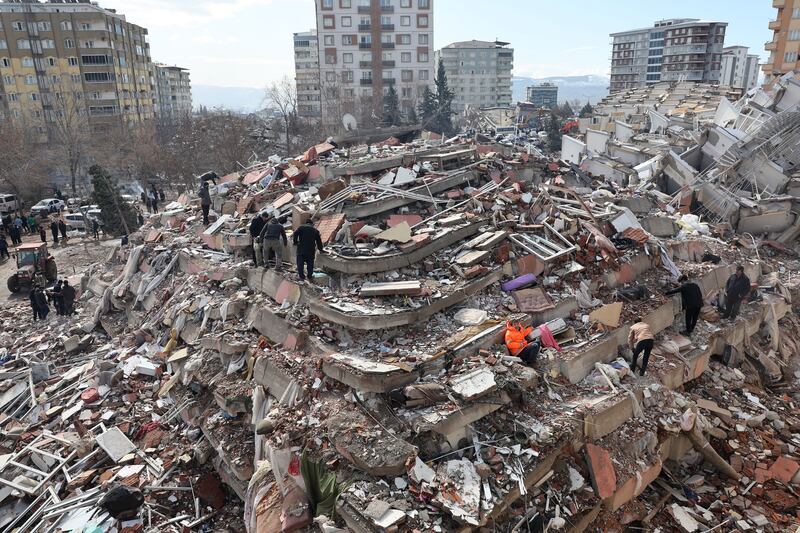 People search for survivors under the rubble in Kahramanmaras, Turkey. Photograph: Adem Altan/AFP via Getty Images