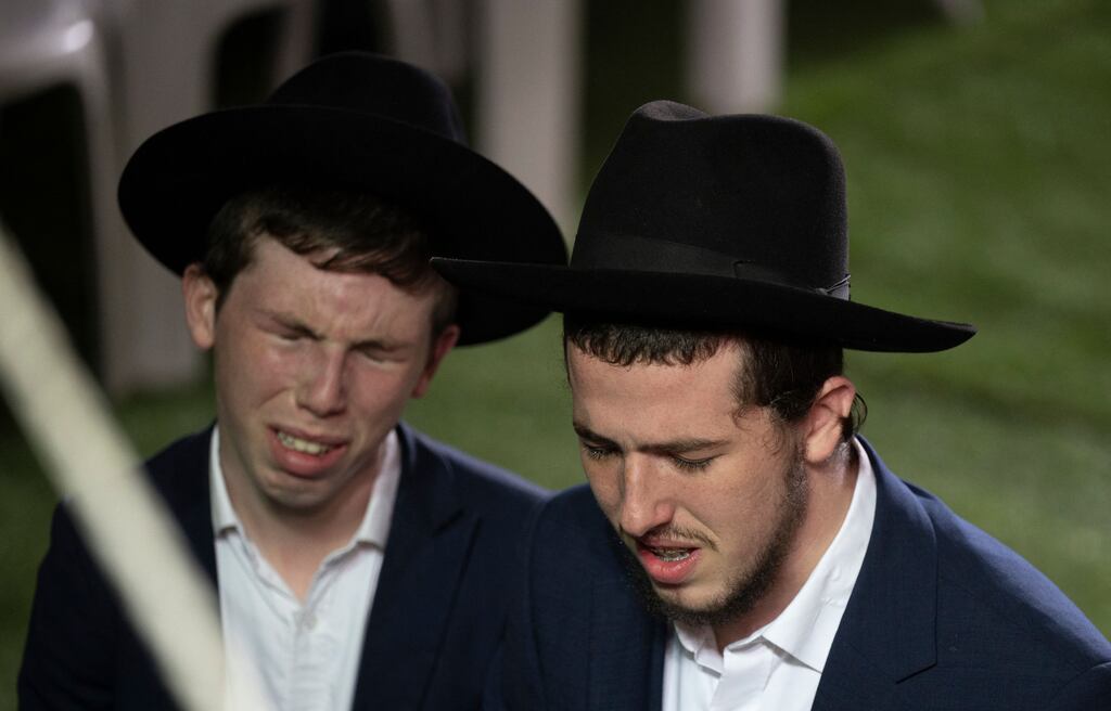 Israelis mourn as they attend the funeral of Israeli Defence Forces soldier Noam Elimeleh Rothenberg, who was killed in fighting with Hamas, at Mount Herzel Cemetery in Jerusalem on Tuesday. Photograph: Yuri Cortez/AFP via Getty Images