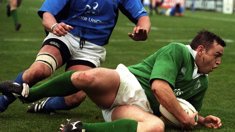 Rob Henderson goes over for one of his three tries in the Six Nations game against Italy at the Stadio Flaminio in Rome in February 2001. Photograph: Patrick Bolger/Inpho