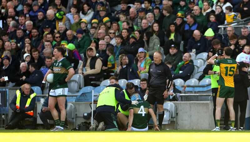 Kerry’s Dylan Casey receives treatment following a tackle from Donegal's Michael Murphy. Photograph: James Crombie/Inpho