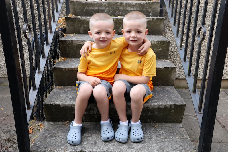 Seven-year-old twins Brody (left) and Ryan Dunne. Brody was struck by an e-scooter near his home in Finglas, causing him a head injury and concussion. Photograph: Alan Betson/The Irish Times

