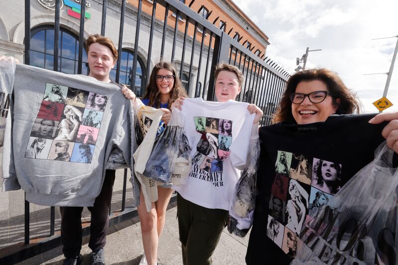 James Moran, Aimee Flynn, Conor Moran and Tracy Corbett-Flynn from Malahide and Portmarnock, Co Dublin, snapped up some Taylor Swift merchandise at the pop-up store at the 3Arena. Photograph: Alan Betson

