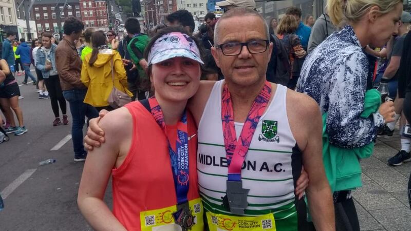 Peter Gunning (right) at the finish line of Cork City Marathon.