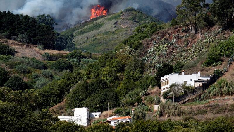 Flames gather on a hilltop in Valleseco, Gran Canaria, Canary Islands, on Sunday.  Photograph: Angel Medina G/EPA
