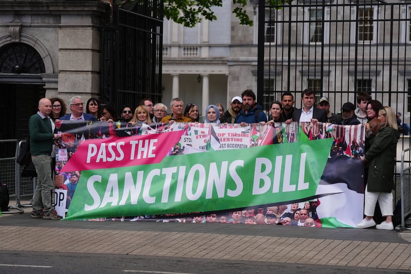 People Before Profit leader Richard Boyd Barrett, along with politicians and pro-Palestine supporters outside Leinster House on Thursday in advance of the Dáil debate on the Sanctions against the State of Israel Bill. Photograph: Brian Lawless/PA Wire 