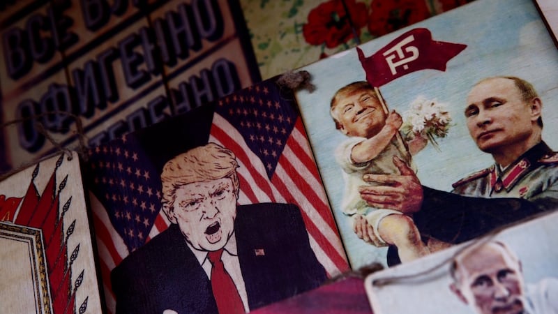 Pictures depicting Russian president Vladimir Putin and US president Donald Trump on  sale at Izmailovsky Market in Moscow. Photograph: Christian Hartmann/Reuters