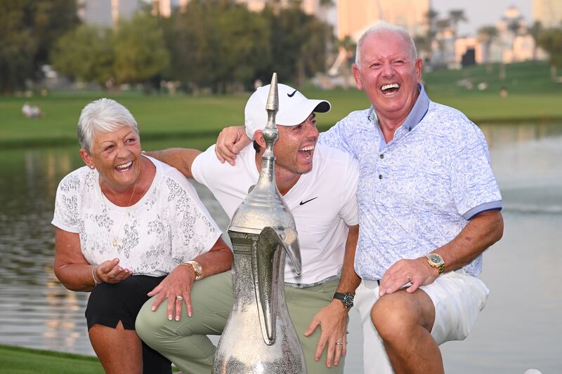 Rory McIlroy with his parents, Rosie and Gerry McIlroy, along with the trophy after the final round of the Dubai Desert Classic in the UAE in January, 2024. Photograph: Ross Kinnaird/Getty Images