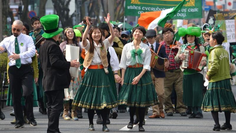 People  march during a St Patrick’s Day parade in Tokyo. More than 1,000 took part in the event. Photograph: Kazuhiro Nogi/AFP/Getty Images.