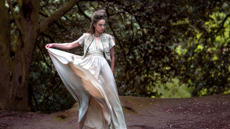 Gold embossed leather cropped zip jacket €795, silk halter dress with gold braided trim €995. Photograph: Una Williams