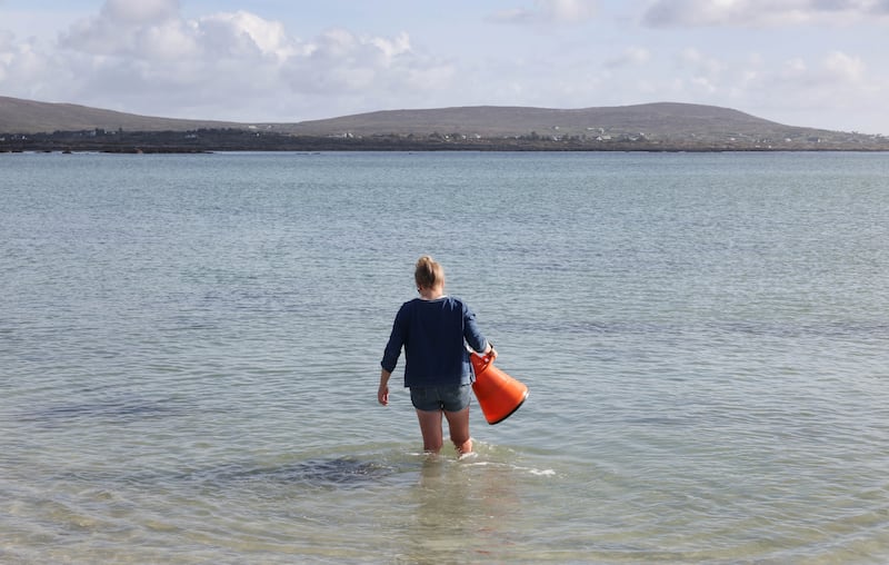 Siobhán Kennedy walks out in Mweenish Bay with a bathyscope