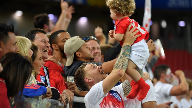 England’s Kieran Trippier celebrates with his family following the victory over Colombia. Photograph:  Dan Mullan/Getty Images