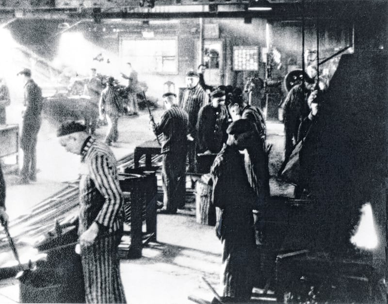 Forced labour at a locksmith's shop in Auschwitz under the command of an SS-Rottenfuhrer, 1942-1943. Photograph: Galerie Bilderwelt/Getty