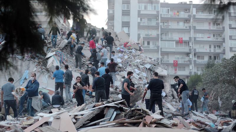 Rescue workers and civilians search for survivors after a 7.0 magnitude earthquake in the Aegean Sea in Izmir, Turkey. Photograph: Stringer/EPA