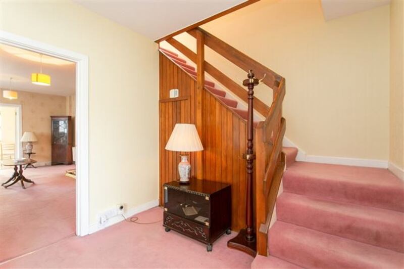 The original hall of their home. They flipped the staircase so that they could conceal much of it and create a point of difference between the open living area and the accomodation.  Photograph Max Fedorov