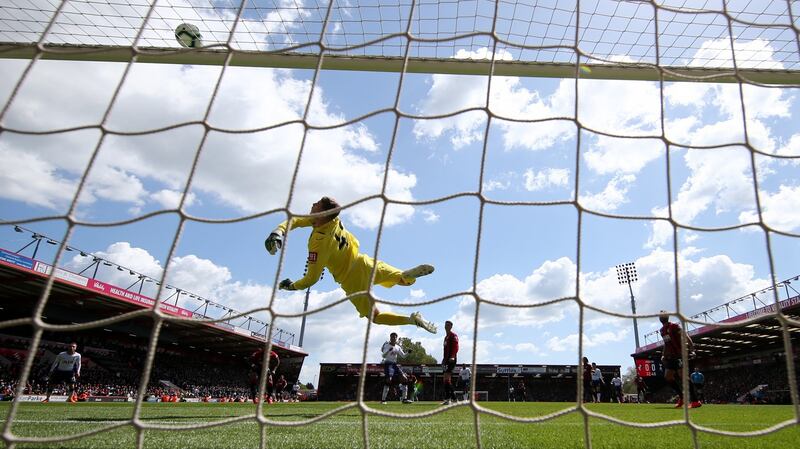 Mark Travers of AFC Bournemouth makes a save during his debut against  Tottenham last May. Photo: Warren Little/Getty Images