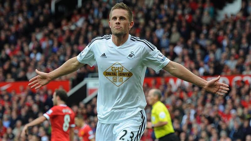 Swansea City’s Gylfi Sigurdsson cerebrates scoring the winner against Manchester United. Photograph:  Peter Powell / EPA