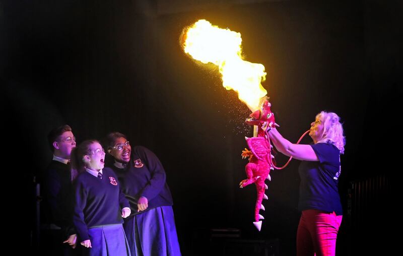 Sue McGrath (Scientific Sue) demonstrate how dragons work for Sophie Kelly (16), Rachelle Biayi (16) and Karl Fitzpatrick (15) at the launch of the 2019 BT Young Scientist & Technology Exhibition Photograph: Niall Carson/PA Wire