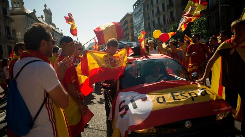 Protesters hold Spanish flags during a demonstration called by “Societat Civil Catalana” (Catalan Civil Society) to support the unity of Spain. Photograph: Jorge Guerrero/AFP