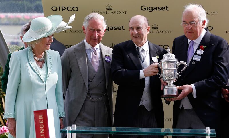 John Magnier (right) accepts a trophy at Royal Ascot 2015 from the then Duchess of Cornwall and Prince of Wales, along with fellow horse owner Michael Tabor. Photograph: Alan Crowhurst/Getty Images for Ascot Racecourse