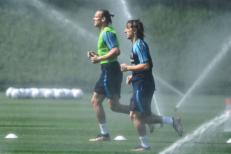 Croatia's midfielder Luka Modric (right) and defender Domagoj Vida run in the heat during a training session at the 2022 World cup in Qatar. Photograph: Ozan Kose/AFP via Getty Images