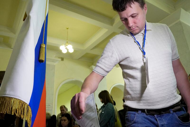 A refugee from Ukraine regions held by Russia casts a ballot for a referendum on joining Russia in Rostov-on-Don on September 24th, 2022. Photograph: AFP via Getty Images