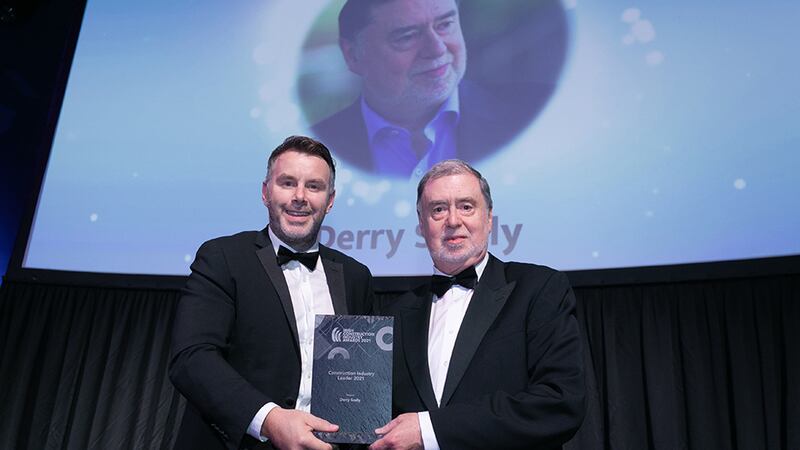 Kevin O'Driscoll, Director Partner Programmes, BusinessRiver, presents the Construction Industry Leader 2021 award to Derry Scully.