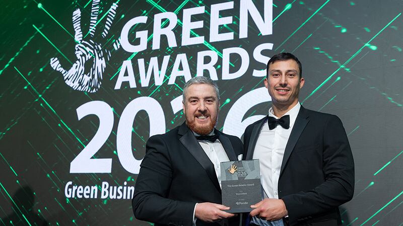 Eddie Moloney, corporate account manager at Panda, presents the green retailer award to Andrew McGregor, Tesco Ireland