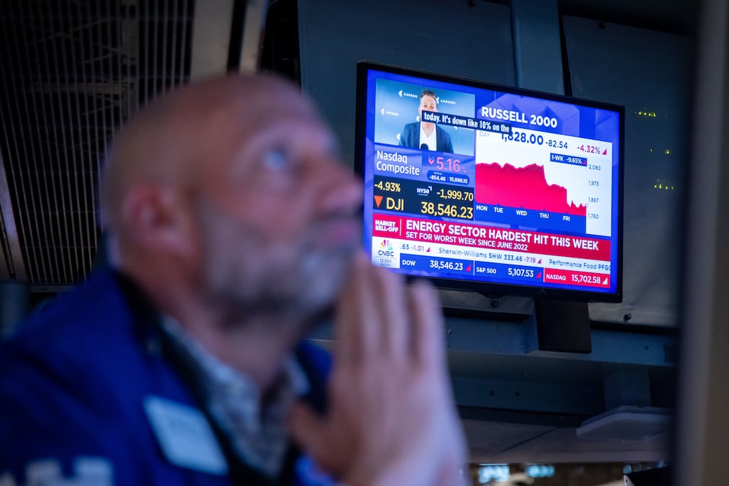 Let us pray: a trader at the New York Stock Exchange. Photograph: Michael Nagle/Bloomberg