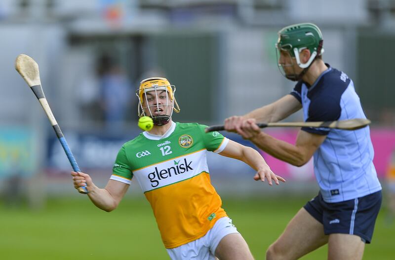 Dublin's Chris Crummey is challenged by Offaly's Conor Doyle. Photograph: Tommy Grealy/Inpho