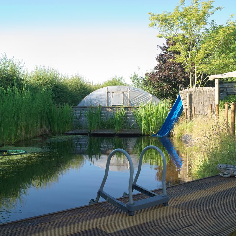 An old garden slide that now doubles-up as a waterslide for the pool. Photograph: Richard Johnston