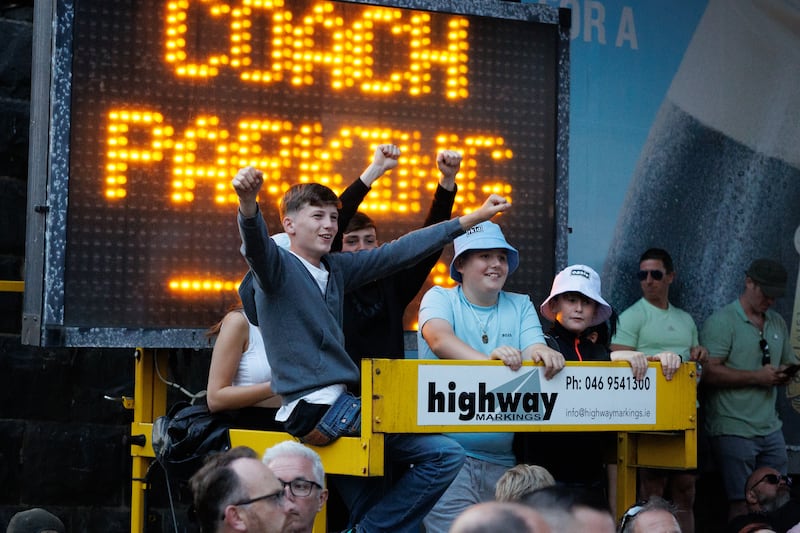 Fans without tickets listen to Oasis from outside Croke Park on night two. Photograph: Dan Dennison