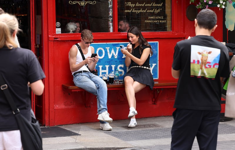 People enjoying the pub scene in Temple Bar. Photograph: Dara Mac Dónaill
