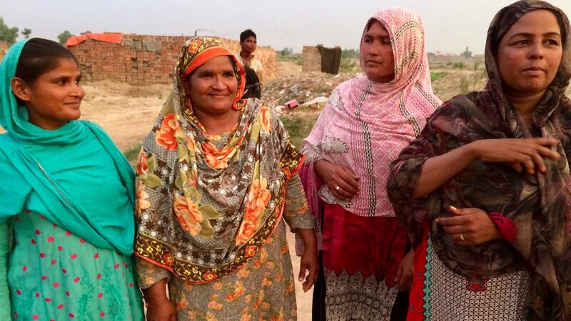 Sangita, Shamin, Nusrat and Maqsudan at a brick kiln in the village of Mian Rashid outside Lahore. Photograph: Lorraine Mallinder