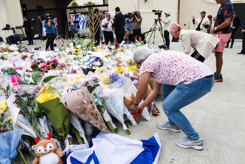 People place flowers at the Bondi Pavilion site, Sydney. Photograph: Evan Treacy for The Irish Times