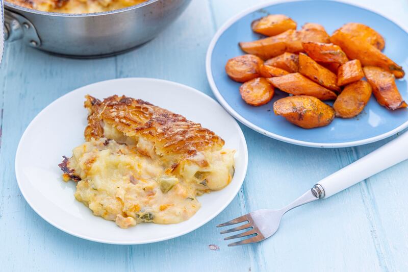 Creamy fish pie with butter roasted carrots. Photographs: Harry Weir