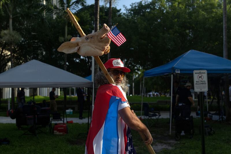 A supporter of outside the Wilkie D Ferguson jnr courthouse in Miami on Tuesday. Photograph: Christian Monterrosa/The New York Times
                      