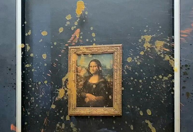 This image grab taken from AFPTV footage shows Leonardo Da Vinci's "Mona Lisa" (La Joconde) painting doused in soup. Photograph: Getty Images