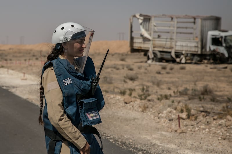 Maya Jolo (22) in front of a minefield in northern Syria. Photograph: Sally Hayden