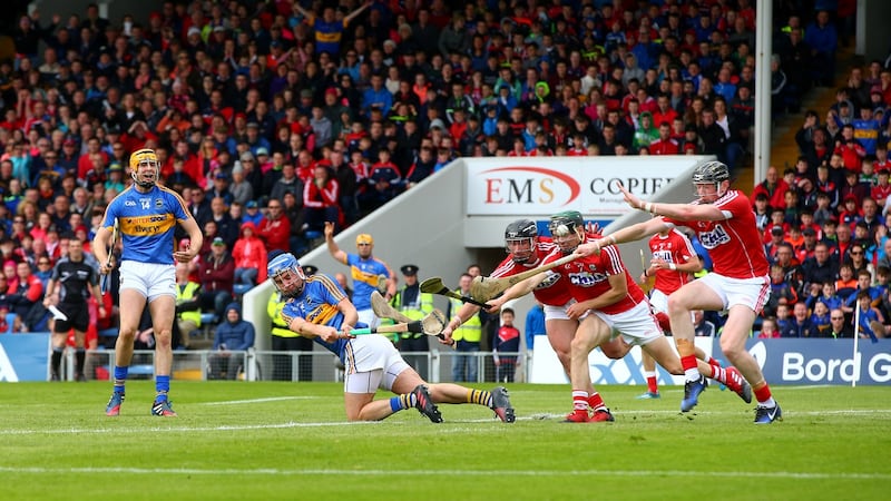 McGrath scores a point despite the efforts of Cork’s Colm Spillane, Mark Coleman and Damian Cahalane. Photo: Cathal Noonan/Inpho