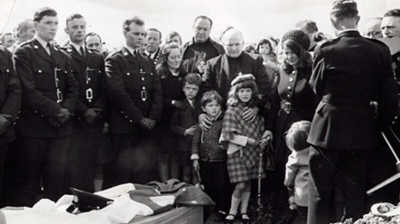 Garda Richard Fallon’s family surrounded by mourners at his funeral in 1970. Photograph: Fallon family