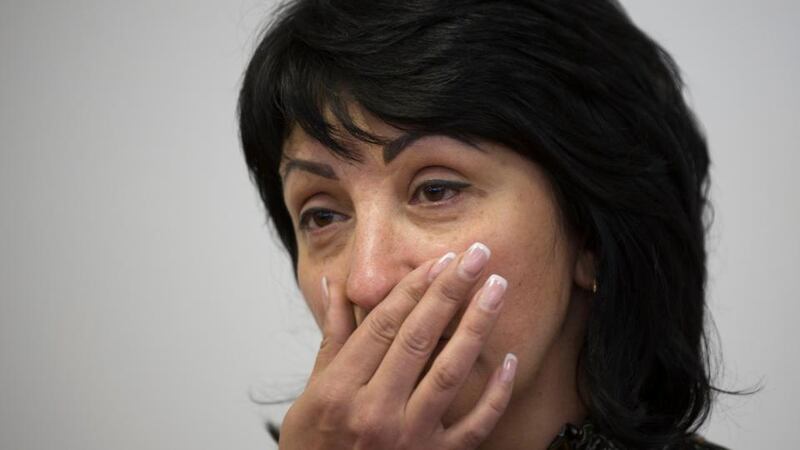 Yelena Rybak, widow of Batkivschyna party member Volodymyr Rybak,   speaks to the media in Donetsk on Wednesday after the discovery of her husband’s body. Photograph: AP/Alexander Zemlianichenko