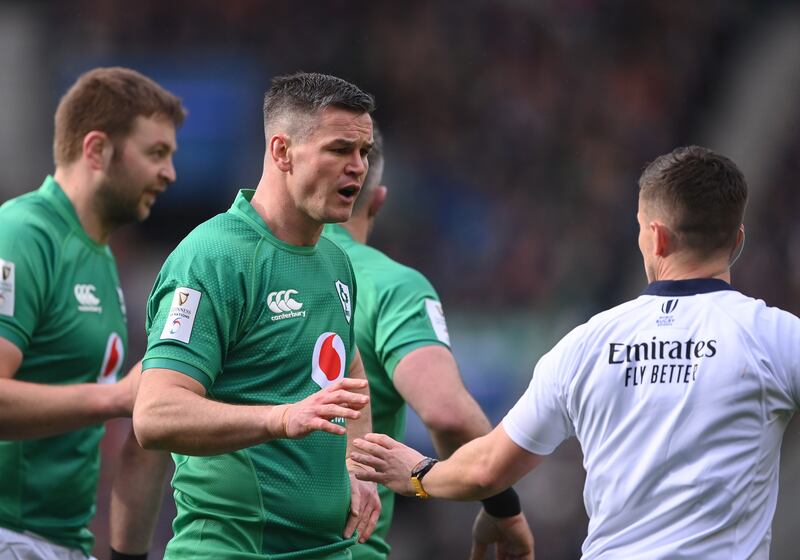 Johnny Sexton speaks to referee Luke Pearce at Murrayfield. His selfless attitude resonates strongly among his peers, and there will be a part of every person involved that wants to complete the Grand Slam for him. Photograph: Stu Forster/Getty Images