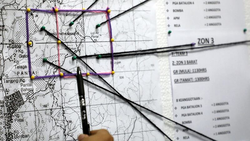 A police officer shows a rescue operation map for 15-year-old Irish girl Nora  Quoirin  during a news conference in Seremban, Malaysia on Wednesday. Photograph:  Lim Huey Teng/Reuters