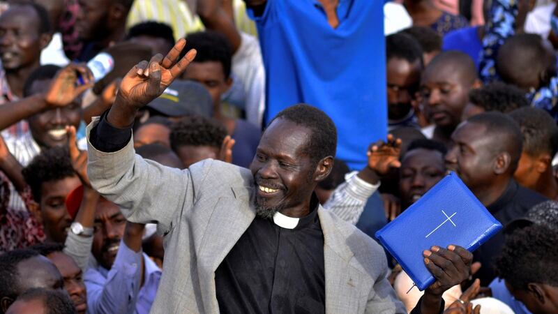 A protester holds  outside the defence ministry in Khartoum, Sudan, on Sunday. Photograph: Reuters