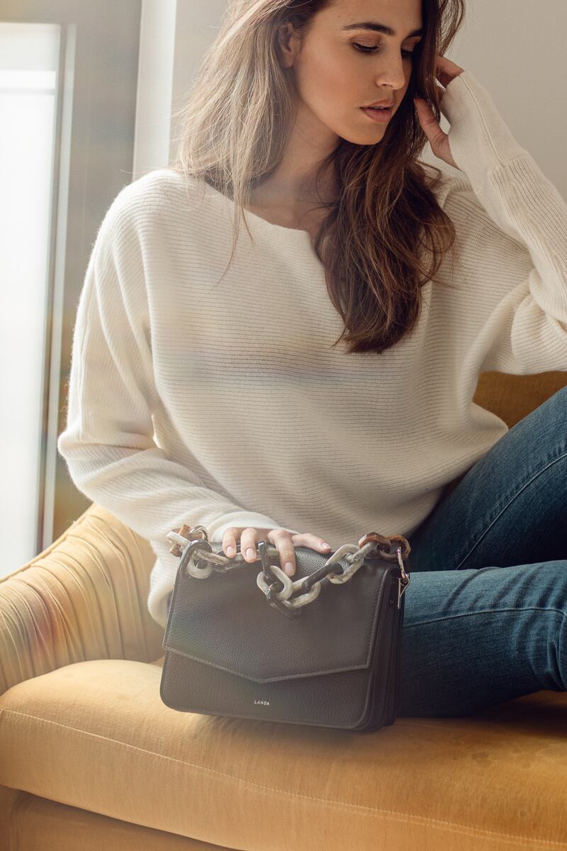 Landa plexichain black bag (€420), Theo + George skinny jeans (€249) and thumbhole cashmere sweater (€279)