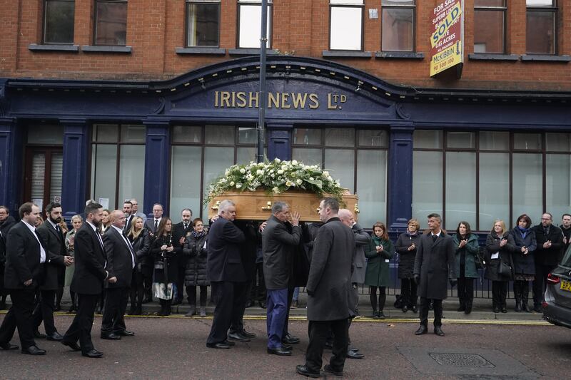 The coffin of Olympic medallist and press photographer Hugh Russell is taken past the offices of the Irish News following his funeral at St Patrick's Church in Belfast. Photograph: Niall Carson/PA Wire 