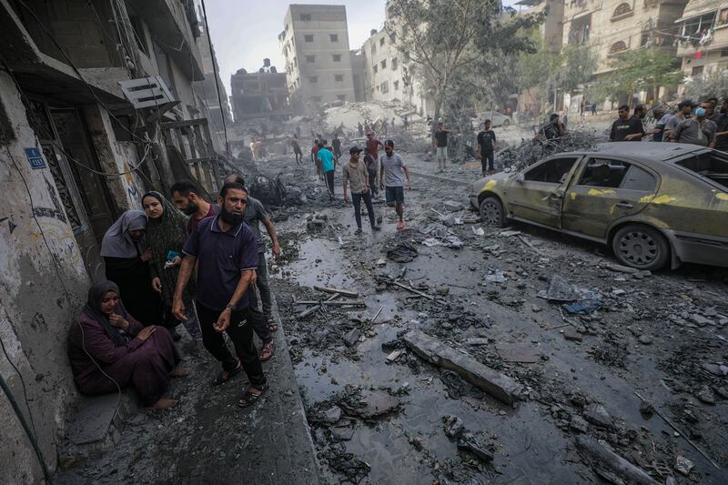 Palestinians in a destroyed area after Israeli air strikes in Gaza City on October 23rd, 2023. More than 4,700 Palestinians and over 1,400 Israelis have been killed since October 7th, according to the Israel Defense Forces and the Palestinian health authority. Photograph: EPA-EFE